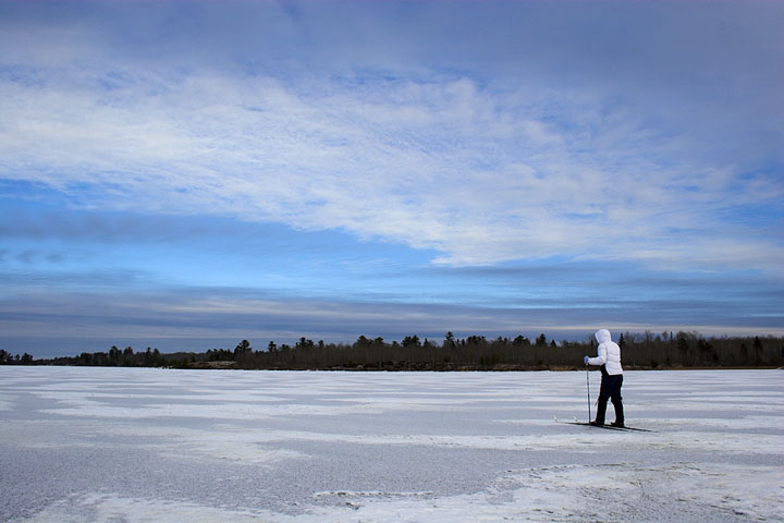 skiing across an ice-covered lake in Minnesota