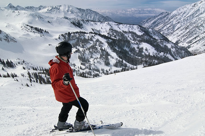 skier looking at snow-covered Utah mountains
